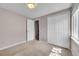Neutral bedroom featuring carpet, and a double door closet at 7077 S Knolls Way, Centennial, CO 80122