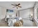 Cozy primary bedroom with plush carpeting, ceiling fan and a large double closet at 7077 S Knolls Way, Centennial, CO 80122