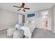 Relaxing primary bedroom with double closets, ceiling fan and ensuite bathroom access at 7077 S Knolls Way, Centennial, CO 80122