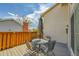 Outdoor deck featuring a table with seating and a umbrella, creating an inviting entertainment space at 7077 S Knolls Way, Centennial, CO 80122