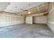 Unfinished garage with concrete floor and overhead lighting, ready for customization at 7077 S Knolls Way, Centennial, CO 80122