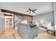 Inviting living room with a fireplace, wooden beam and a staircase at 7077 S Knolls Way, Centennial, CO 80122
