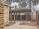 Backyard retreat with a wooden gazebo and a stamped concrete patio area at 10000 E Yale Ave # 58, Denver, CO 80231
