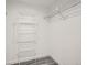 A walk-in closet with wire shelving for ample storage at 10000 E Yale Ave # 58, Denver, CO 80231