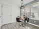 A dining area featuring modern decor, a chandelier and plenty of natural light at 10000 E Yale Ave # 58, Denver, CO 80231