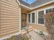 Charming home entrance featuring a decorative screen door, well-maintained landscaping, and a stone walkway at 10000 E Yale Ave # 58, Denver, CO 80231