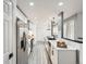 A modern kitchen featuring stainless steel appliances, white cabinets, and an island at 10000 E Yale Ave # 58, Denver, CO 80231