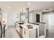 Contemporary kitchen with white cabinets, stainless steel appliances, and an open layout to the dining area at 10000 E Yale Ave # 58, Denver, CO 80231