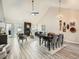 Spacious living and dining areas featuring modern decor, a fireplace, and a bright ambiance, ideal for hosting guests at 10000 E Yale Ave # 58, Denver, CO 80231
