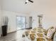 A serene bedroom with a door leading to a patio and a well-lit en-suite bathroom at 10000 E Yale Ave # 58, Denver, CO 80231
