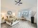 A cozy bedroom with a bay window and neutral tones at 10000 E Yale Ave # 58, Denver, CO 80231