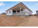 The back of this home features a covered patio and a spacious yard at 24741 E 33Rd Dr, Aurora, CO 80019