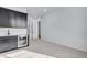 Modern bar area with sleek black cabinets and a beverage cooler at 24741 E 33Rd Dr, Aurora, CO 80019