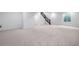Unfinished basement offers large open area with neutral carpet and staircase at 24741 E 33Rd Dr, Aurora, CO 80019
