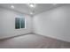An unfinished basement bedroom with neutral carpet, egress window and ample sunlight at 24741 E 33Rd Dr, Aurora, CO 80019