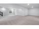 Large, open unfinished basement with neutral carpet and an egress window at 24741 E 33Rd Dr, Aurora, CO 80019