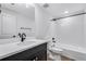Modern bathroom with black fixtures, white subway tile, and a single vanity at 24741 E 33Rd Dr, Aurora, CO 80019