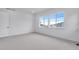 Bright bedroom featuring carpet floors and large window at 24741 E 33Rd Dr, Aurora, CO 80019