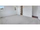 Bright bedroom featuring carpet floors and attached bathroom at 24741 E 33Rd Dr, Aurora, CO 80019