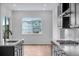 Kitchen with dark cabinets, marble countertops, and stainless steel appliances at 24741 E 33Rd Dr, Aurora, CO 80019