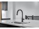 Kitchen sink with a modern faucet and marble countertops at 24741 E 33Rd Dr, Aurora, CO 80019