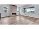 Living room with a fireplace and large windows for ample natural light at 24741 E 33Rd Dr, Aurora, CO 80019