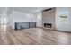 Bright living room with a sleek fireplace and modern finishes at 24741 E 33Rd Dr, Aurora, CO 80019