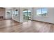 Open living area with a fireplace, hardwood floors, and sliding glass doors at 24741 E 33Rd Dr, Aurora, CO 80019