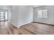 Bright and airy living room with light hardwood floors, recessed lighting, and a modern color scheme at 24741 E 33Rd Dr, Aurora, CO 80019