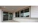 Covered porch features large windows and a sliding glass door at 24741 E 33Rd Dr, Aurora, CO 80019