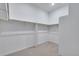 A neutral-colored walk-in closet has built-in shelving for optimal storage at 24741 E 33Rd Dr, Aurora, CO 80019