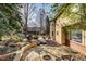 An attractive backyard stone patio with a fire pit and lots of room for entertaining at 2464 Ginny Way, Lafayette, CO 80026