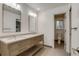 This bathroom has double sinks, updated fixtures, and a separate toilet room at 2464 Ginny Way, Lafayette, CO 80026