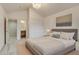 Comfortable bedroom with neutral tones, carpet flooring, and en-suite bathroom at 2464 Ginny Way, Lafayette, CO 80026