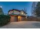 Two-story home featuring a three-car garage and a well-manicured lawn, complete with mature landscaping at 2464 Ginny Way, Lafayette, CO 80026