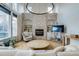 Bright and airy living room with a grand fireplace, recessed lighting and lots of natural light at 2464 Ginny Way, Lafayette, CO 80026