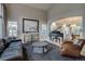 Spacious living room featuring a grand piano, neutral decor, and ample natural light at 2464 Ginny Way, Lafayette, CO 80026