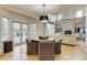 Bright open living space featuring hardwood floors, modern fireplace, and abundant natural light at 2464 Ginny Way, Lafayette, CO 80026