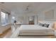 Spacious main bedroom featuring vaulted ceiling, large windows, and hardwood floors at 2464 Ginny Way, Lafayette, CO 80026