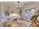 Bright office features custom built-ins, hardwood floors, natural light, and French doors to the patio at 2464 Ginny Way, Lafayette, CO 80026
