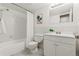 Bathroom with bathtub, toilet and white vanity at 14652 E 2Nd Ave # 202D, Aurora, CO 80011