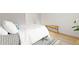 Bedroom with queen-size bed, light wood floors, and access to closet at 14652 E 2Nd Ave # 202D, Aurora, CO 80011