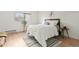 Bedroom with a queen-size bed and light wood floors at 14652 E 2Nd Ave # 202D, Aurora, CO 80011