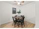 Small dining area with four chairs and wood floors at 14652 E 2Nd Ave # 202D, Aurora, CO 80011