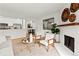 Bright living room with fireplace, hardwood floors, and stylish furniture at 14652 E 2Nd Ave # 202D, Aurora, CO 80011