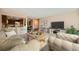 Comfortable living room featuring neutral tones and an open floor plan to kitchen, perfect for modern living at 13961 E Marina Dr # 205, Aurora, CO 80014