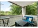 Enjoy outdoor living on this quaint balcony with a table and comfortable bench seating at 7780 W 38Th Ave # 203, Wheat Ridge, CO 80033