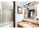 Bathroom with a tiled shower over tub combo and granite topped vanity at 7780 W 38Th Ave # 203, Wheat Ridge, CO 80033