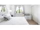 Bright bedroom with white furniture, a large window, and natural light at 7780 W 38Th Ave # 203, Wheat Ridge, CO 80033