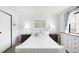 Crisp white bedroom featuring a bed with stylish bedside tables and great natural lighting at 7780 W 38Th Ave # 203, Wheat Ridge, CO 80033